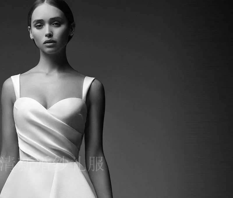 Spring new minimalist satin wedding dress fashion princess sling show thin drag tail bride wedding light wedding dress.